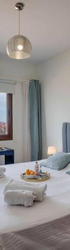 a bedroom with a large bed with towels on it at Glabur Stays! The One -1 - Elite Marina Front! in Zygi