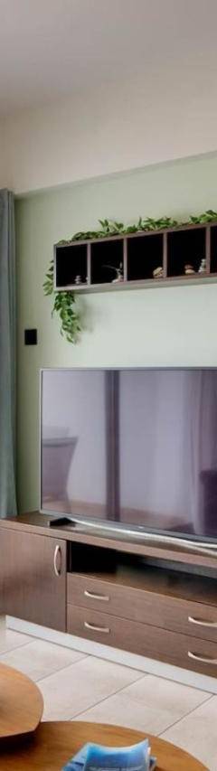 a living room with a television and a balcony at Glabur Stays! The One -1 - Elite Marina Front! in Zygi