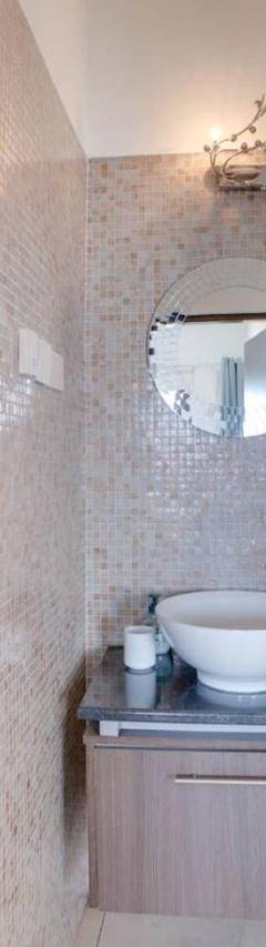 a bathroom with a toilet and a sink and a mirror at Glabur Stays! The One -1 - Elite Marina Front! in Zygi