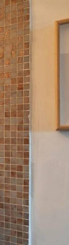 a bathroom with a tile shower with a picture on the wall at Glabur Stays! The One -1 - Elite Marina Front! in Zygi