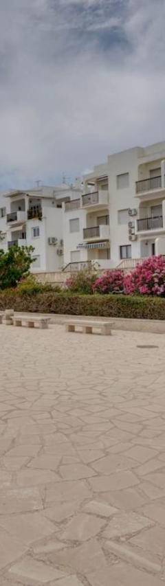 a large parking lot in front of a building at Glabur Stays! The One -1 - Elite Marina Front! in Zygi
