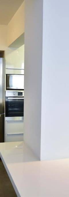 a kitchen with a stainless steel refrigerator in it at Glabur Stays - The Amazing 1 BDR - Executive apt Nicosia Center Free Parking &amp; WiFi in Nicosia