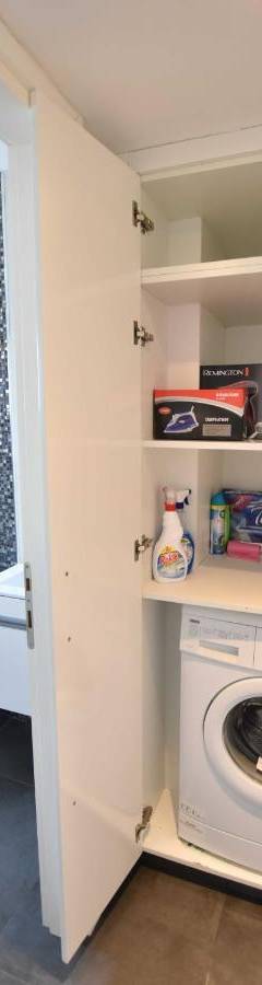 a bathroom with a washing machine and a toilet at Glabur Stays - The Amazing 1 BDR - Executive apt Nicosia Center Free Parking &amp; WiFi in Nicosia