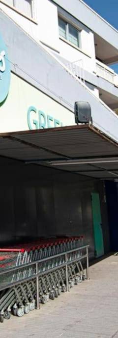 a store on the side of a city street at Glabur Stays - The Amazing 1 BDR - Executive apt Nicosia Center Free Parking &amp; WiFi in Nicosia