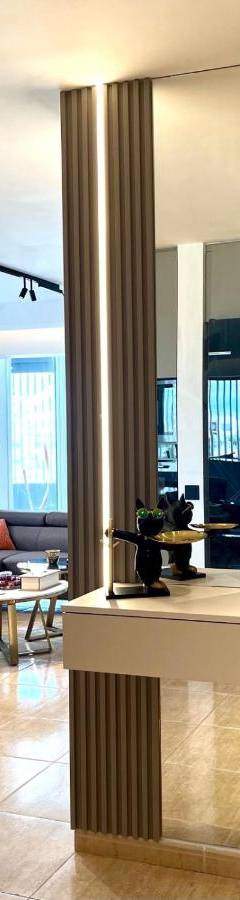 a living room with a couch and a table at Sweet Luxury 2BR Nicosia City in Nicosia