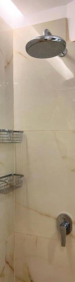 a shower with a shower head in a bathroom at Sweet Luxury 2BR Nicosia City in Nicosia
