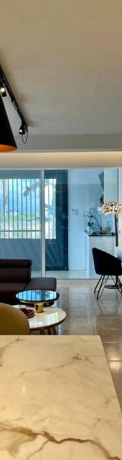 a living room with a couch and a table at Sweet Luxury 2BR Nicosia City in Nicosia