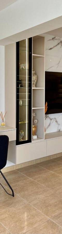 a living room with a tv and a chair and a couch at Sweet Luxury 2BR Nicosia City in Nicosia