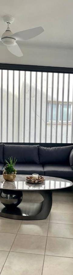 a living room with a couch and a table at Sweet Luxury 2BR Nicosia City in Nicosia