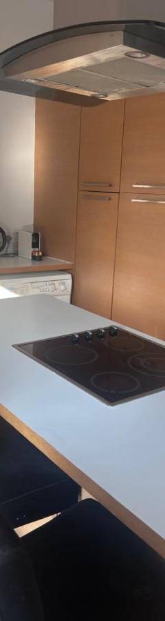 a kitchen with a counter with a stove top oven at Alex Residence in Larnaka