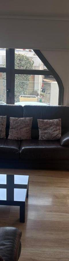a living room with a couch and a table at Alex Residence in Larnaka