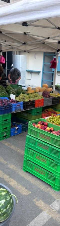 a farmers market with fruits and vegetables on display at Ithaki Phinikoudes Apartment No. 204 in Larnaka