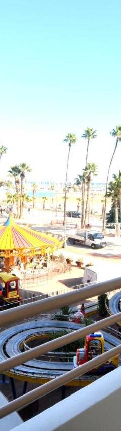 a view of the beach from the balcony of a resort at Ithaki Phinikoudes Apartment No. 105 in Larnaka
