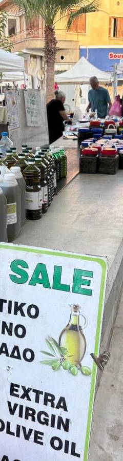 a for sale sign at an outdoor market at Ithaki Phinikoudes Apartment No. 105 in Larnaka