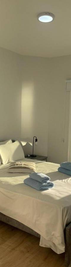 a bedroom with a bed with a view of the ocean at Alex Beach Apartment 34 in Larnaka