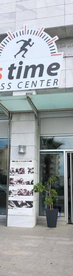a store front of a fitness center with a sign at Ithaki Phinikoudes Apartment No. 107 in Larnaka