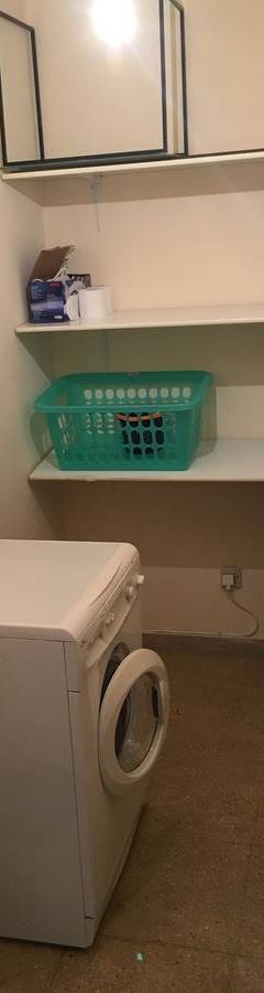 a bathroom with a white toilet in a room at Alex Beach Apartment 51 in Larnaka