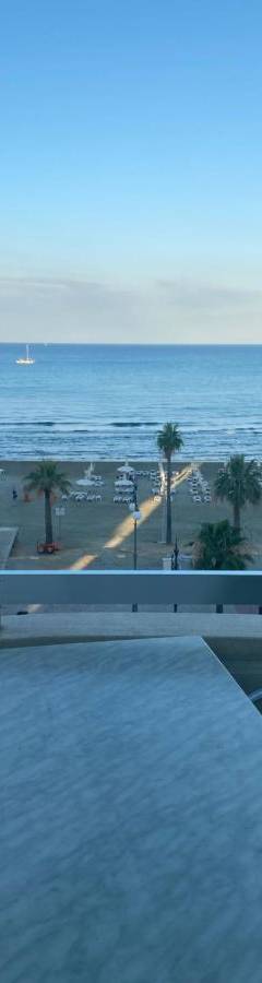 a view of the beach from the balcony of a condo at Alex Beach Apartment 31 in Larnaka
