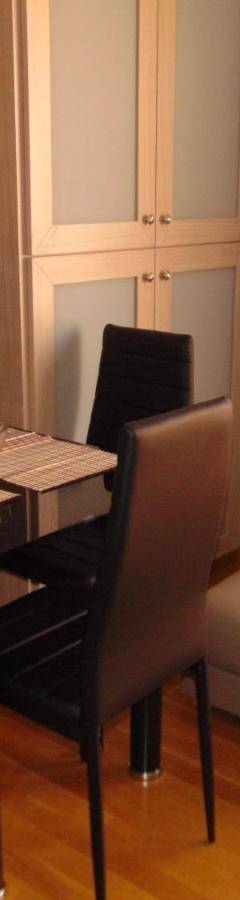 a small room with a table and a chair at Ithaki Phinikoudes Apartment No. 207 in Larnaka