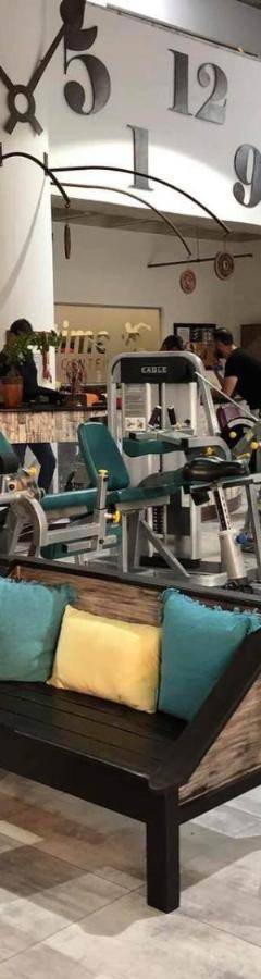 a gym with a bunch of tread machines at Ithaki Phinikoudes Apartment No. 207 in Larnaka