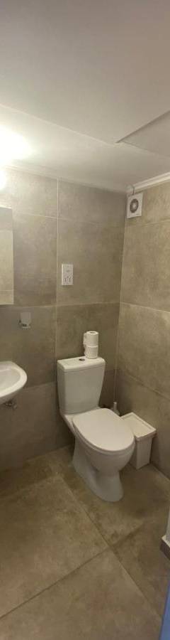 a bathroom with a toilet and a sink at Alex Beach Apartment 33 in Larnaka