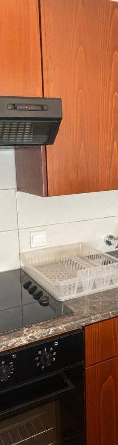 a kitchen with a sink and a stove at Alex Beach Apartment 33 in Larnaka
