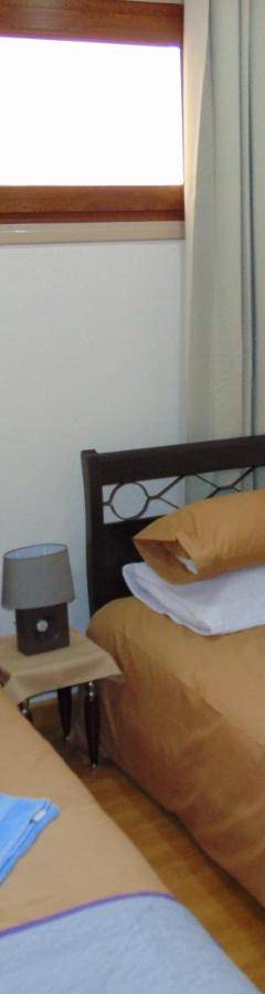 two beds sitting next to each other in a room at Ithaki Phinikoudes Apartments No. 106 in Larnaka