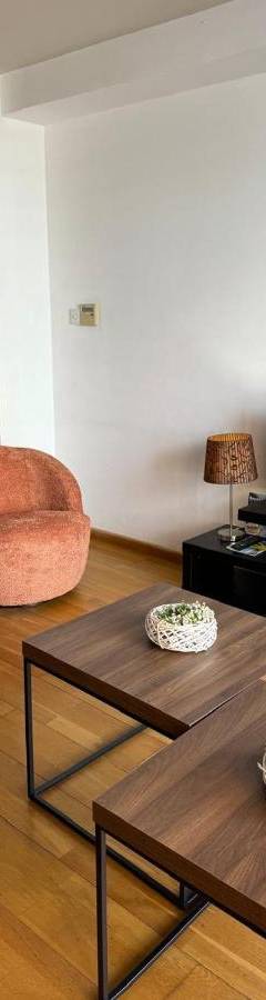a living room with a couch and a tv at Ithaki Phinikoudes Apartments No. 106 in Larnaka