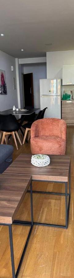 a living room with a couch and chairs and a table at Ithaki Phinikoudes Apartments No. 106 in Larnaka