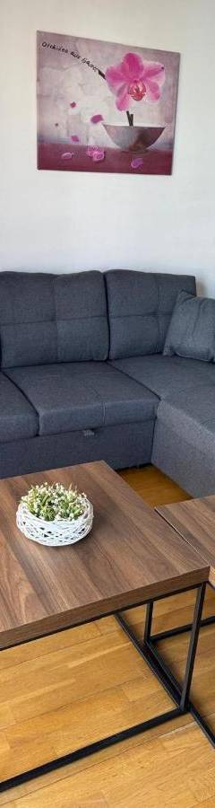 a living room with a couch and a coffee table at Ithaki Phinikoudes Apartments No. 106 in Larnaka