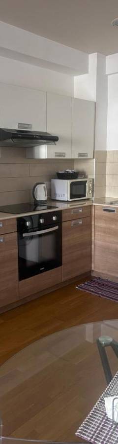 a kitchen with a stove and a dishwasher at Ithaki Phinikoudes Apartment No. 205 in Larnaka