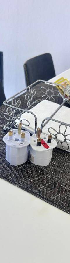 a table with a tray with scissors and other items at Alex Beach Apartment 203 in Larnaka