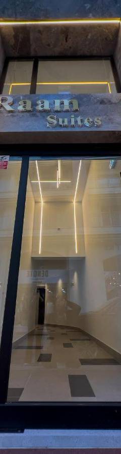 a window in a building with a sign on it at Raam Luxury Suites in Larnaka