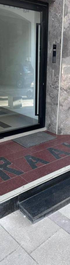 an entrance to a building with a glass door at Raam Luxury Suites in Larnaka