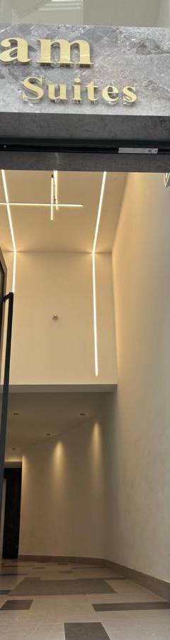 an entrance to a building with a sign that reads ram suites at Raam Luxury Suites in Larnaka