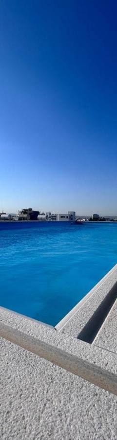 a view of a swimming pool with blue water at Alex Residence in Larnaka
