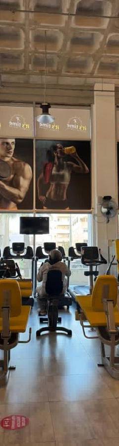 a gym with lots of treadmills and exercise equipment at Alex Residence in Larnaka
